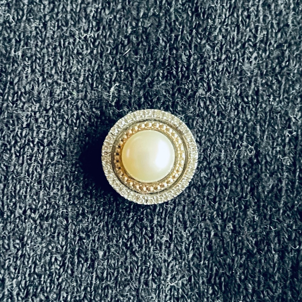 14k gold and silver pendant with diamonds and a center pearl